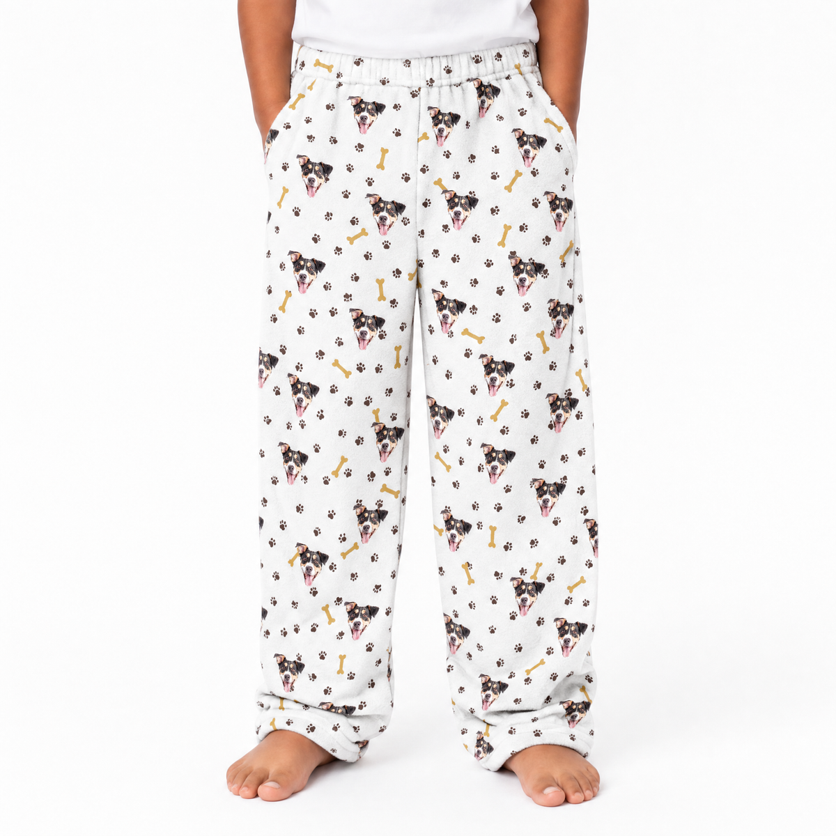 Pajama pants with dog and bone pattern on a white background