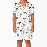 White pajama set with dog pattern on a white background