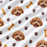 Close-up of the Paws and Bones print showing custom pet faces with brown paw prints and dog bones on a white fabric