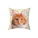 Decorative pillow with a cat's face and Christmas lights on a white background
