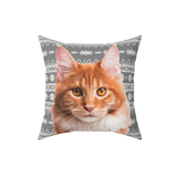 Pillow with a cat face print on a gray christmas pattern