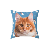 Pillow with a cat's face on a blue background with snowmen