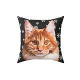 Pillow with a cat design on a black background with white snowflakes
