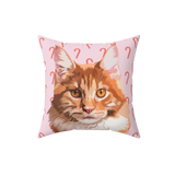 Pillow with a cat design on a pink background with candy cane patterns