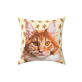 Beige pillow with gingerbread pattern and an illustration of a cat.
