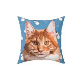 Decorative pillow with a cat's face on a blue background with snowmen and snowflakes.