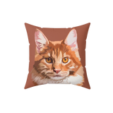Pillow with a cat face illustration on a brown background