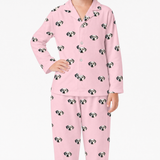 Pink pajama set with dog pattern on a white background