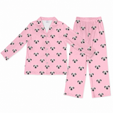 Pink pajama set with dog pattern on a white background