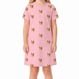 Pink nightgown with dog pattern worn by a person on a white background
