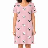 Pink nightgown with Dalmatian pattern worn by a person on a white background