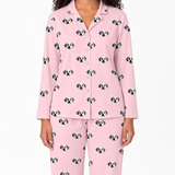 Pink pajama set with dog pattern on a white background