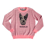 Pink knit sweater with a dog face and the name Marlo