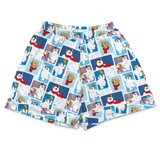 A pair of white boxer shorts featuring a colorful cartoon print of polar bears, snowmen, and dogs in winter outfits, displayed against a solid white background.