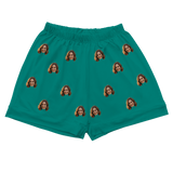 Teal pajama shorts with elastic waist, featuring evenly spaced prints of a smiling woman’s face[SolidGreenPajamaShorts]