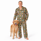 A man wearing a green plaid pajama set with a dog print pattern stands barefoot next to a golden retriever dog on a white studio background.