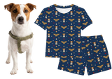 Dog wearing a Wonder Woman-themed outfit with a matching t-shirt and shorts on a white background