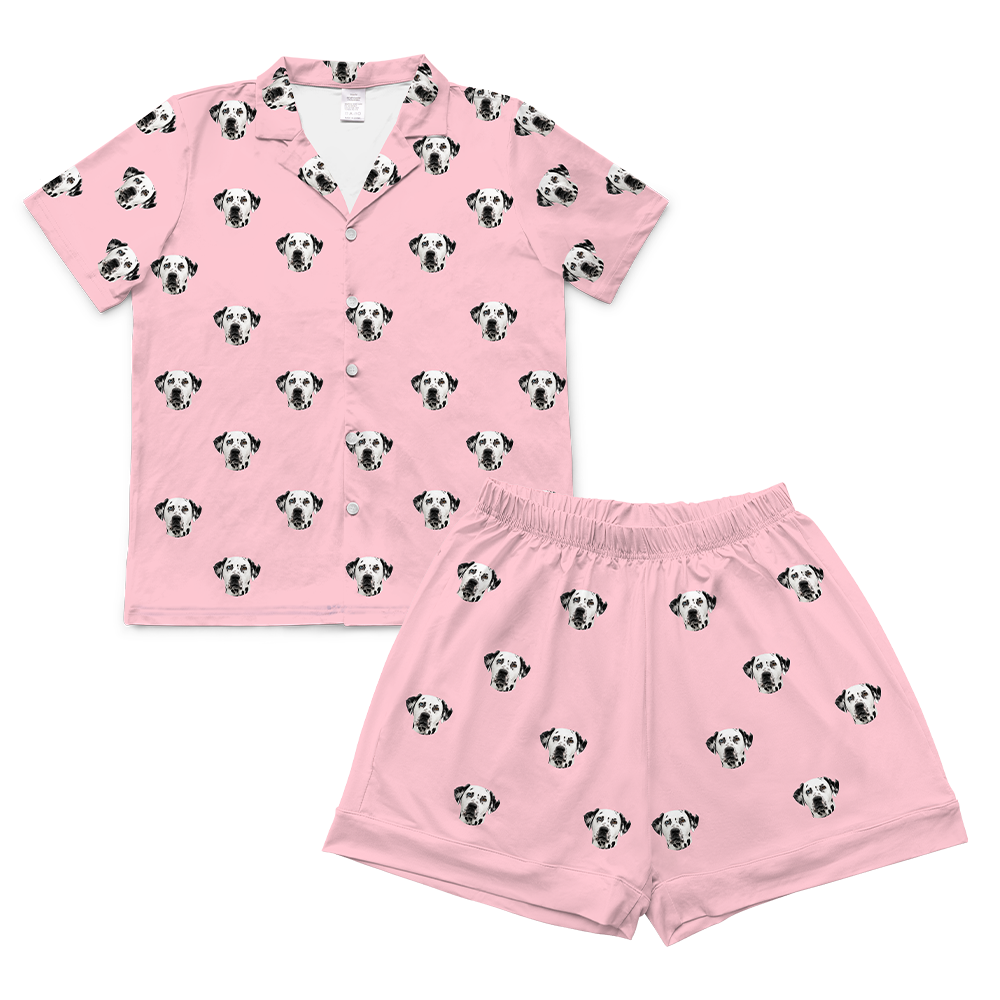 Pink pajama set with dog pattern on a white background