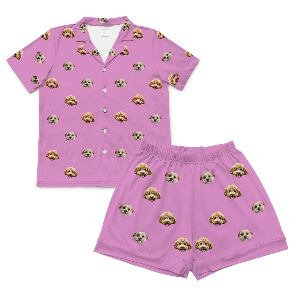 
A matching short-sleeve pajama set in an orchid color. It features an all-over repeating pattern of the faces of two different small dogs.