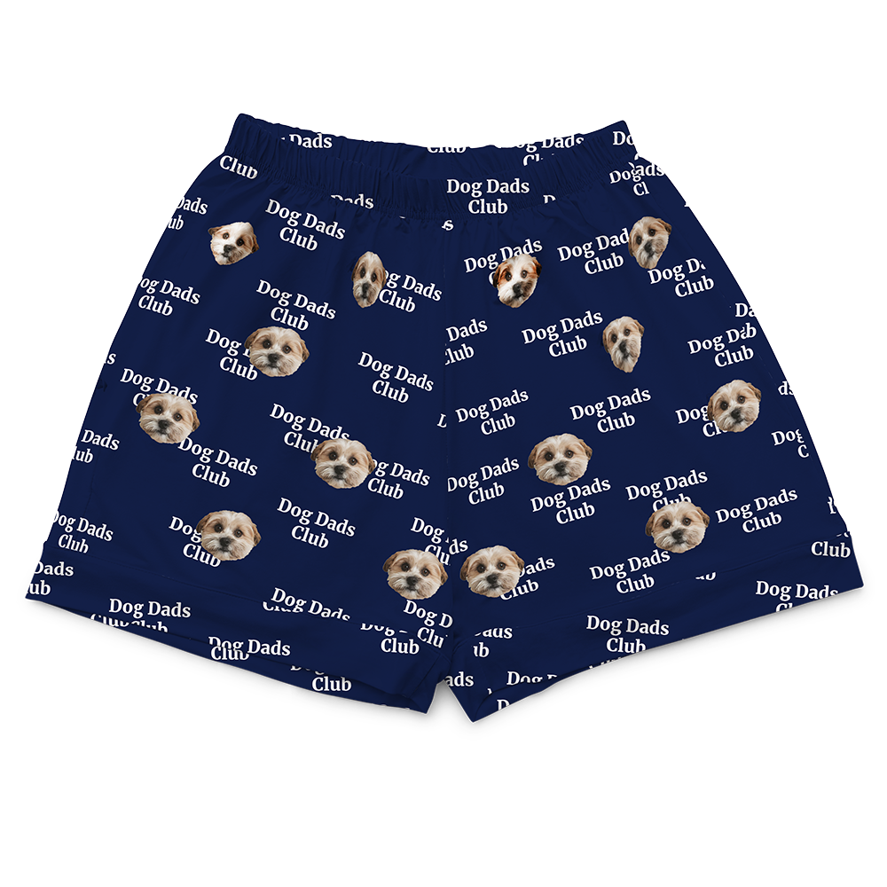 Navy blue boxer briefs with 'Dog Dads Club' text and dog images on a white background