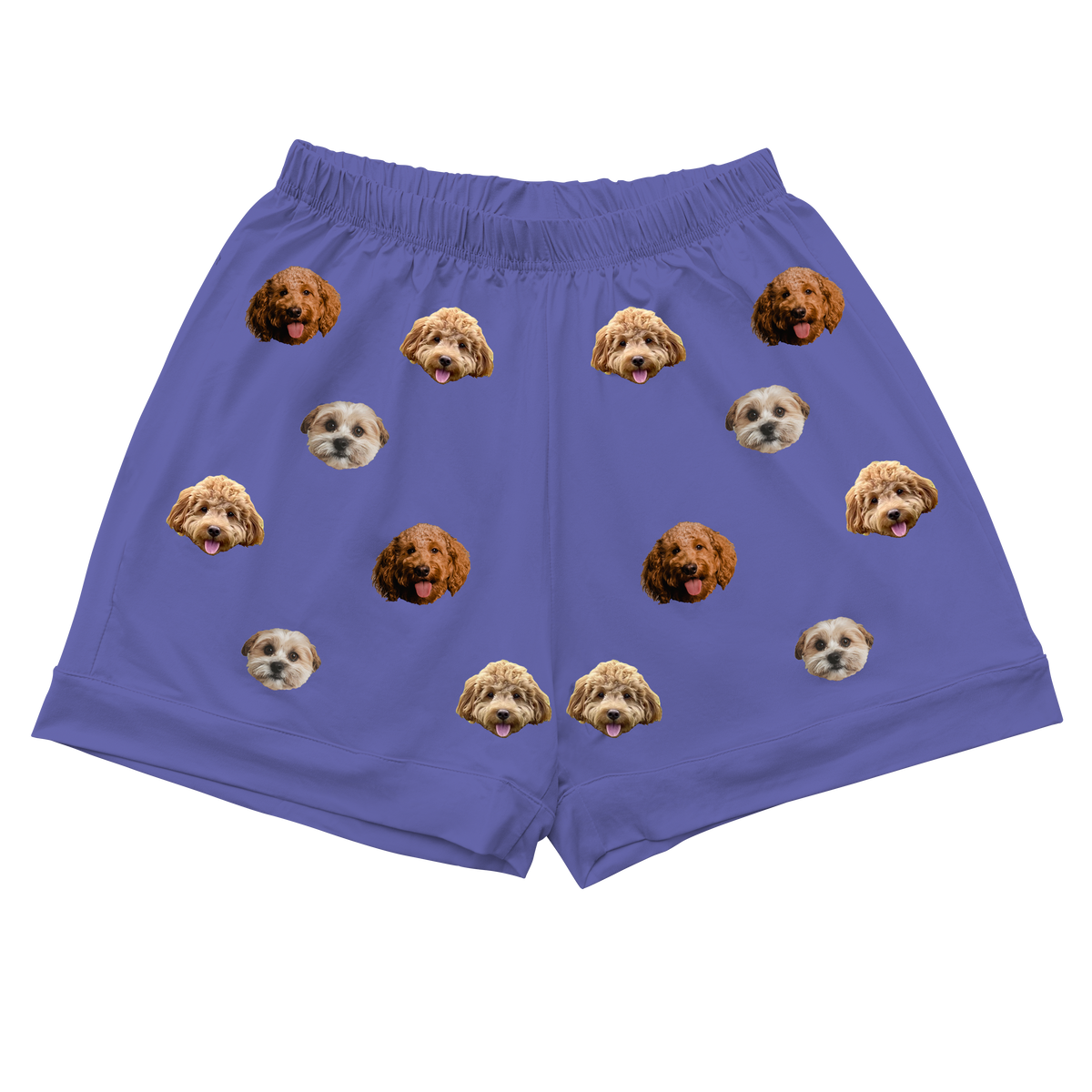 A pair of solid grape purple pajama shorts with an elastic, gathered waistband, laid flat on a light gray background. The shorts feature a scattering of repeated images of three different dog faces