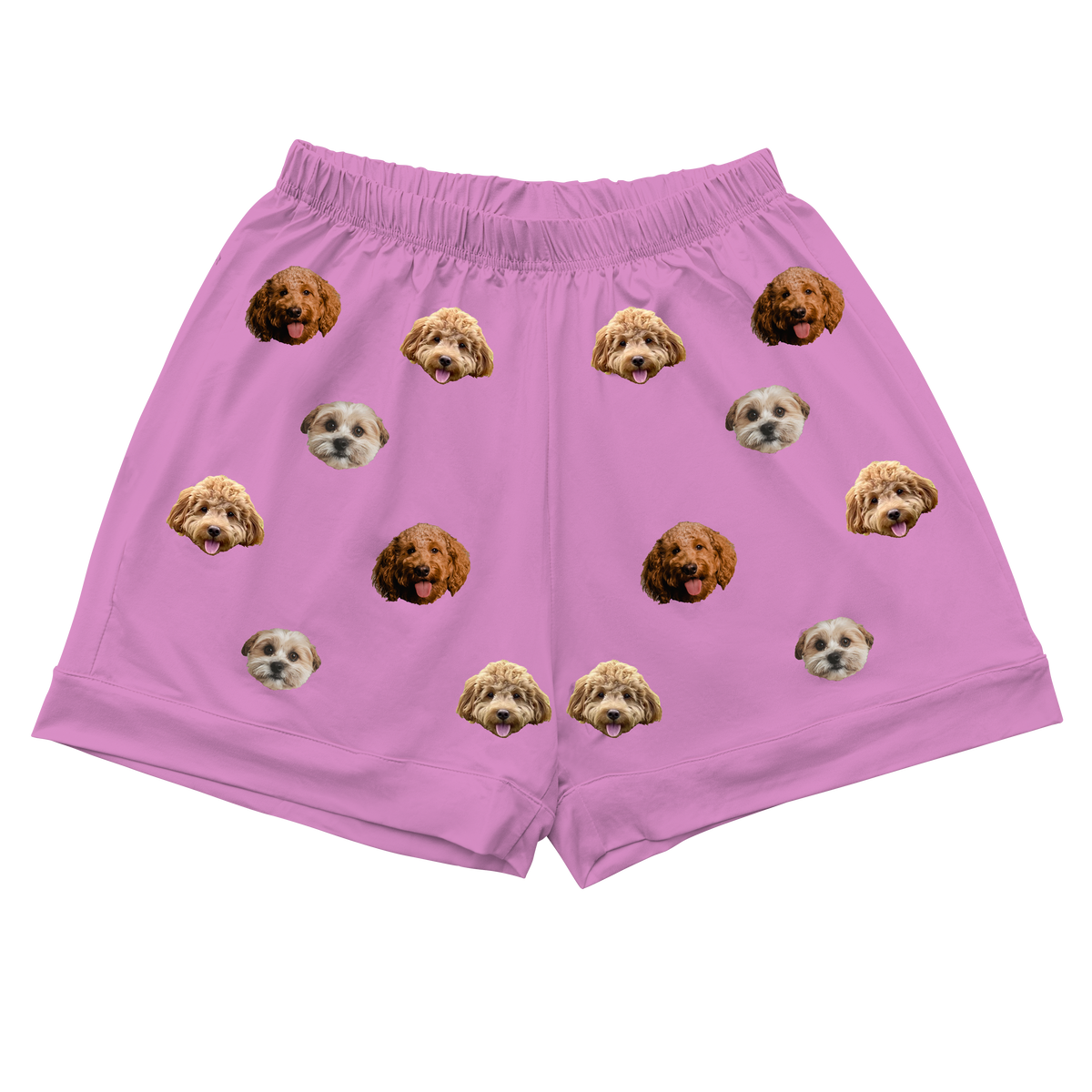 Pink shorts with three dog faces pattern on a white background