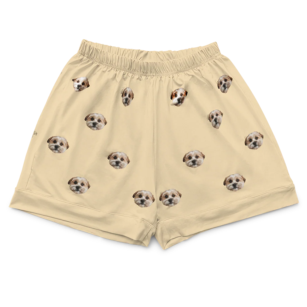 These are pajama shorts in a yellow color with repeating pet faces on them[PajamaShorts($45.00)]