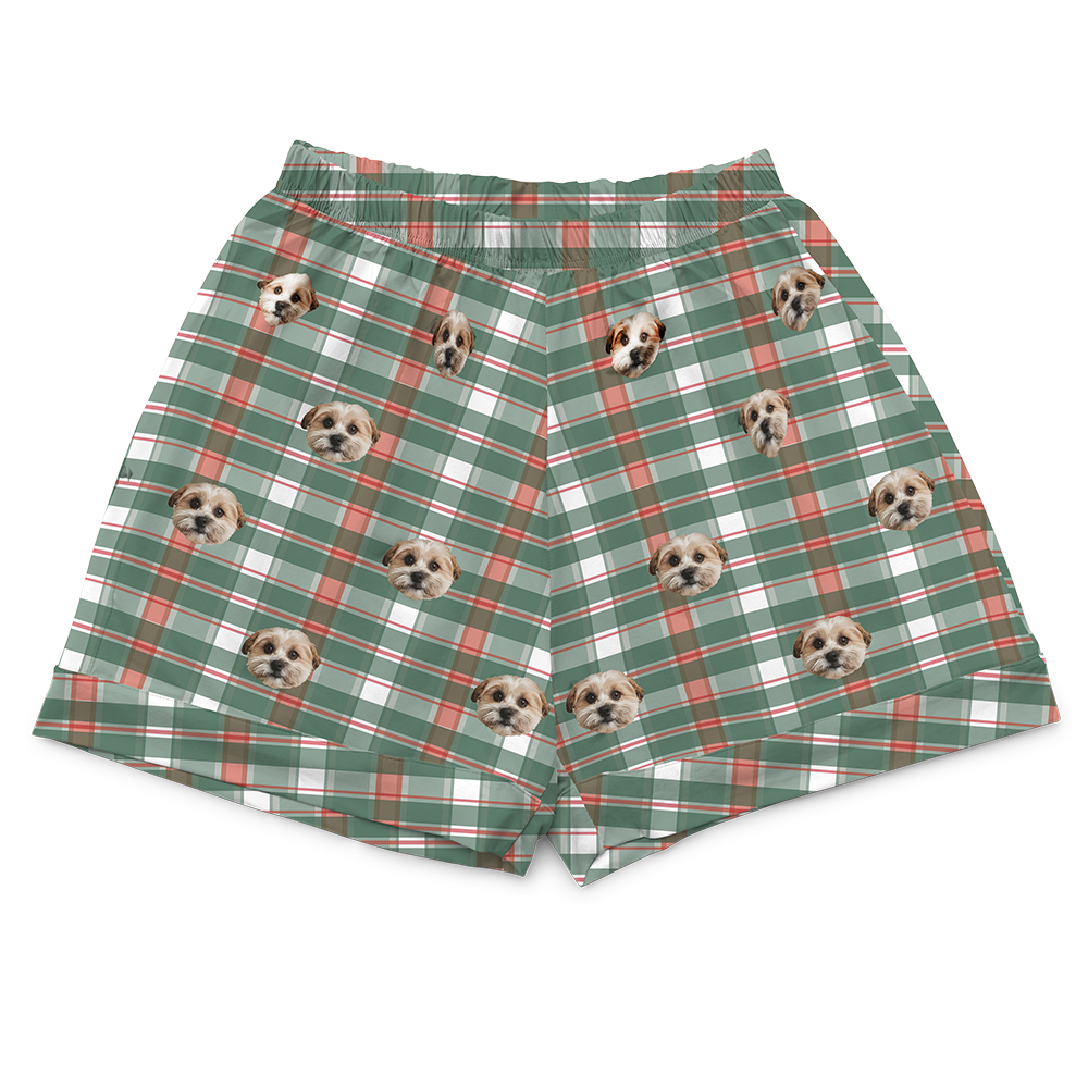 Plaid shorts with dog faces on a white background