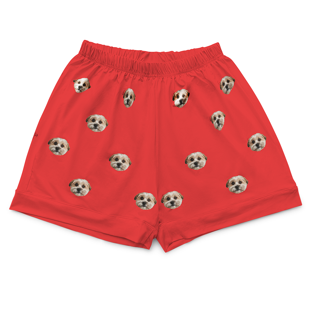 Red pajama shorts with a repeating custom pattern of the photo head of a single, light-colored dog.