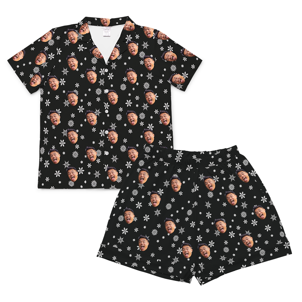 Black short-sleeve pajama set with white snowflakes and repeating wide-open, tongue-out face prints[BlackandWhiteSnowflakesShortSleevePajamaShirt&ShortsSet]