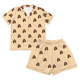 Butter-yellow short pajamas and shorts with repeating smiling woman face prints[ButterYellowShortSleevePajamaShirt&ShortsSet]