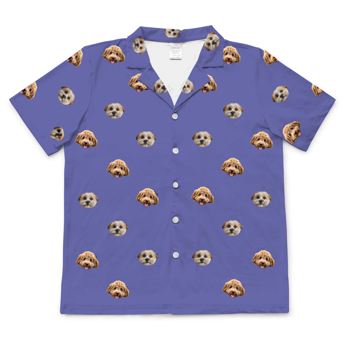A short-sleeve, button-down pajama top in a grape color (medium purple). It features an all-over repeating pattern of a single small, fluffy dog's face, scattered randomly across the fabric.