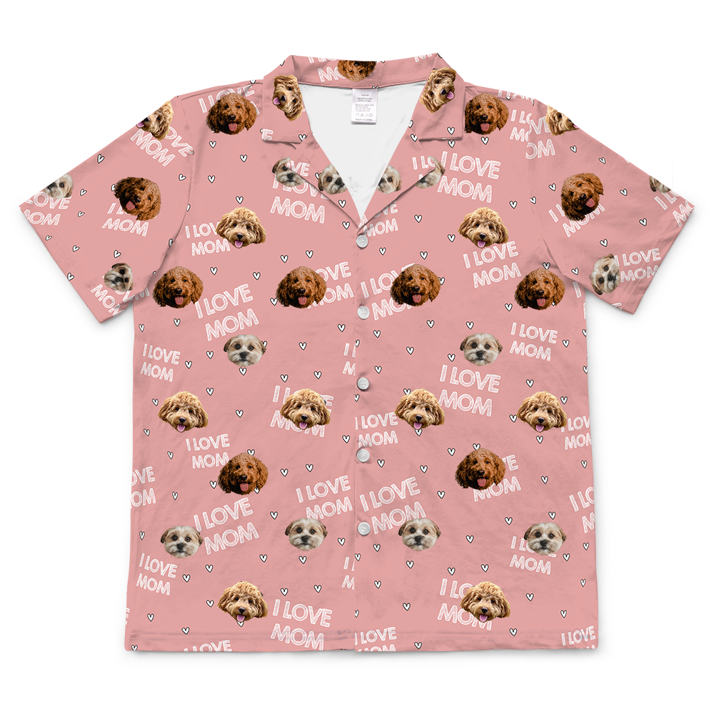 Short-sleeve, button-down pajama top in light pink, featuring a repeating pattern of "I LOVE MOM," tiny hearts, and the faces of three different dogs.