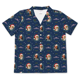 A navy blue short-sleeve button-up camp shirt with a repeating Christmas-themed print featuring dog portraits wearing Santa hats, surrounded by green wreaths, white snowflakes, and the text 'CANDID CROWNS'.