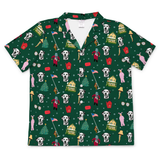 A short-sleeve button-up shirt with a dark green holiday-themed print featuring Dalmatian dogs, Santa Claus, Christmas trees, houses, and festive icons, shown flat against a white background.