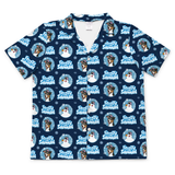 A short-sleeve button-up camp shirt in navy blue, featuring a repeating pattern of a dog's face inside a circular snow globe with the text 'Freezy Snowman' and light blue snowflakes.