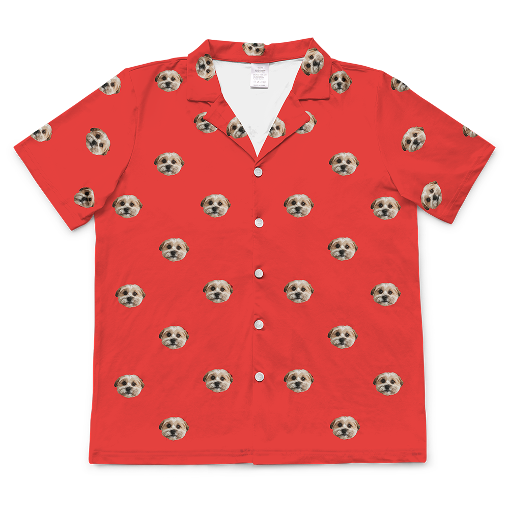 Personalized short-sleeved pajama top on a bright red background, featuring a repeating pattern of the face of a single, light-colored dog.