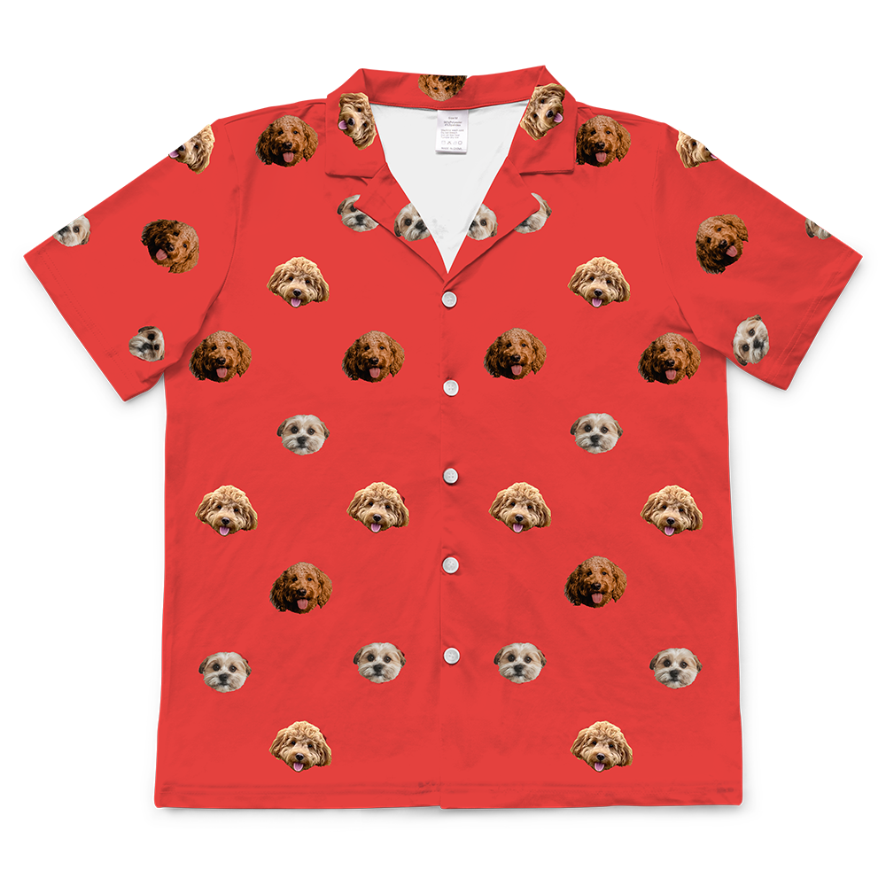 Personalized short-sleeved pajama top on a bright red background, featuring a repeating pattern of the faces of three different small dogs.