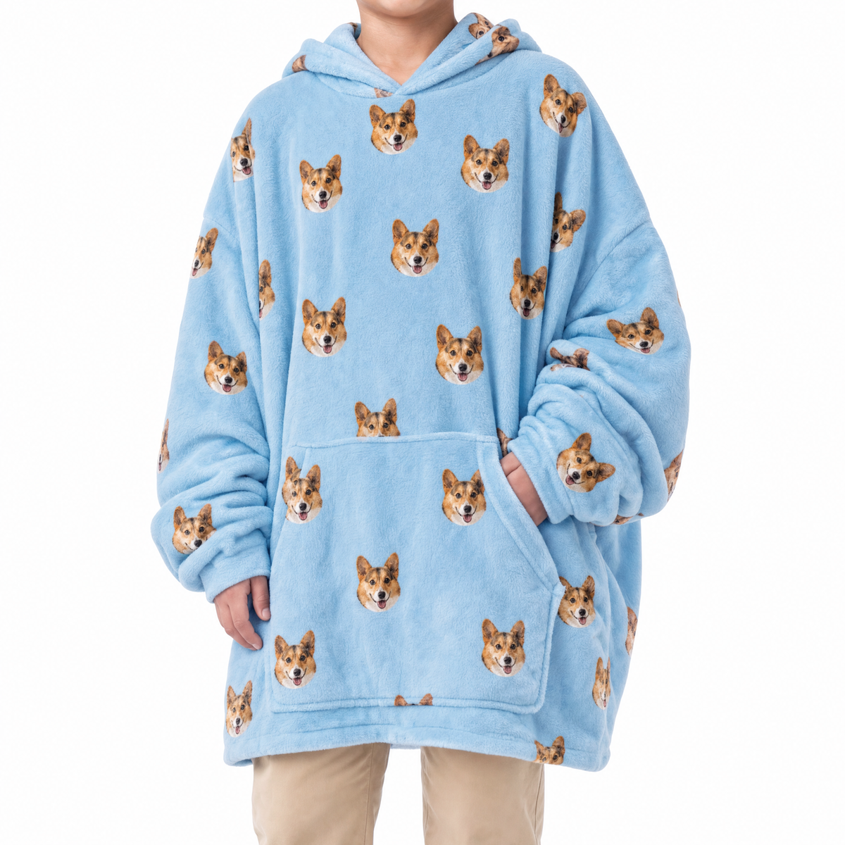 Sky blue blanket hoodie with dog pattern worn by a person on a white background