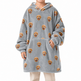 Gray blanket hoodie with dog pattern worn by a person on a white background