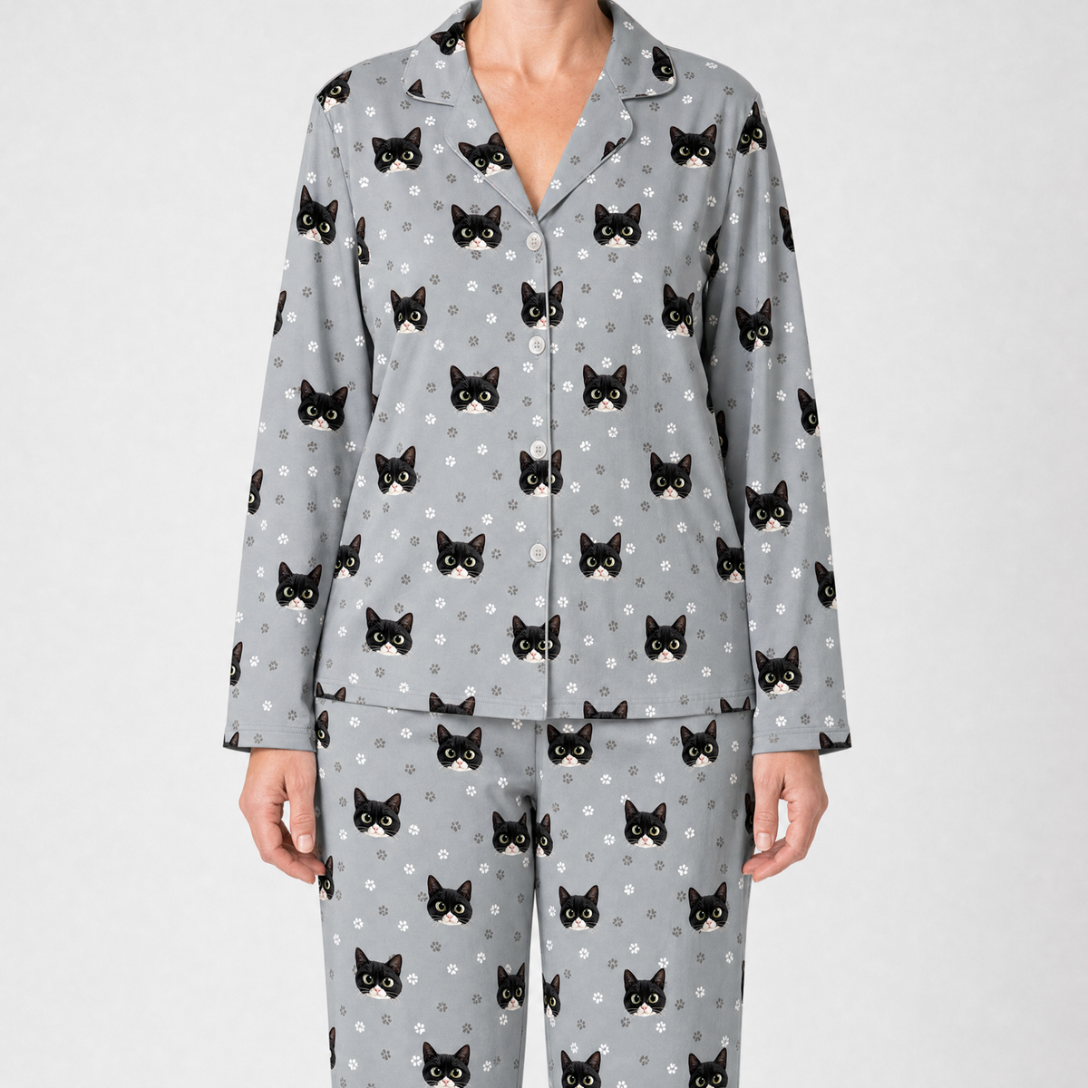 Gray pajama set with black cat pattern on a white background