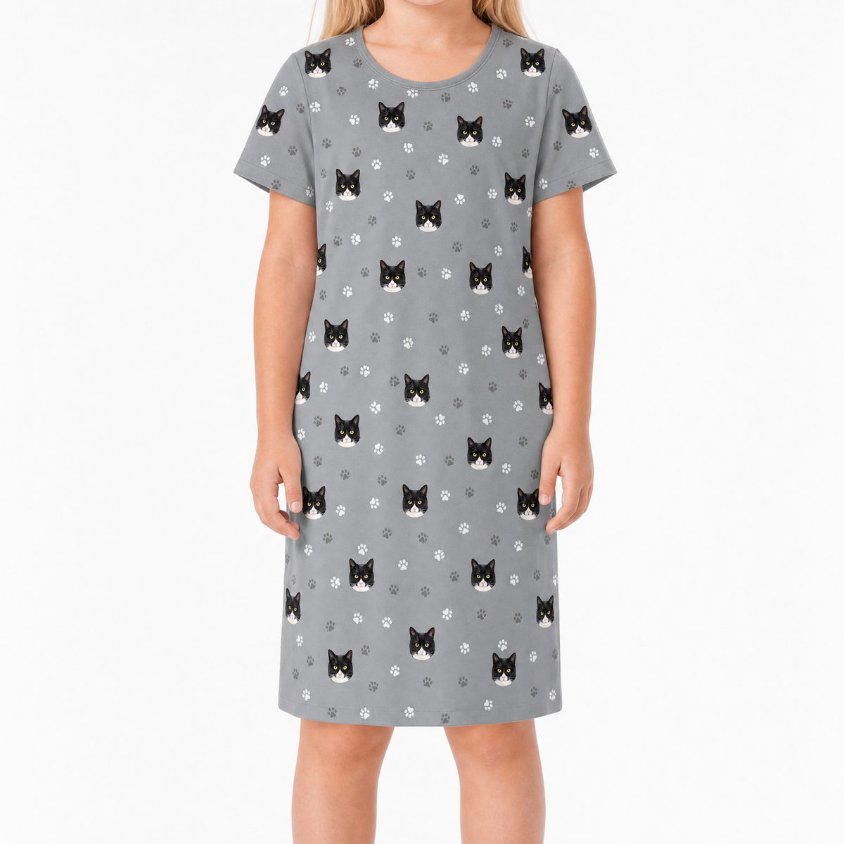 Gray nightgown with black cat pattern worn by a person on a white background