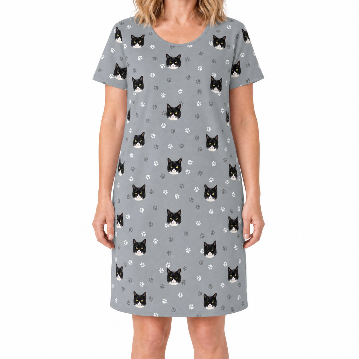 Gray nightgown with black and white cat pattern worn by a person on a white background