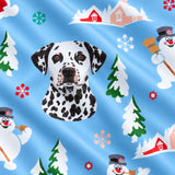 Close-up of the Snow Day print showing custom pet faces with snowmen, pine trees and snowy cottages on a light blue fabric