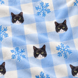 Close-up of the Snowy Gingham print showing custom pet faces and snowflakes on a light blue gingham fabric