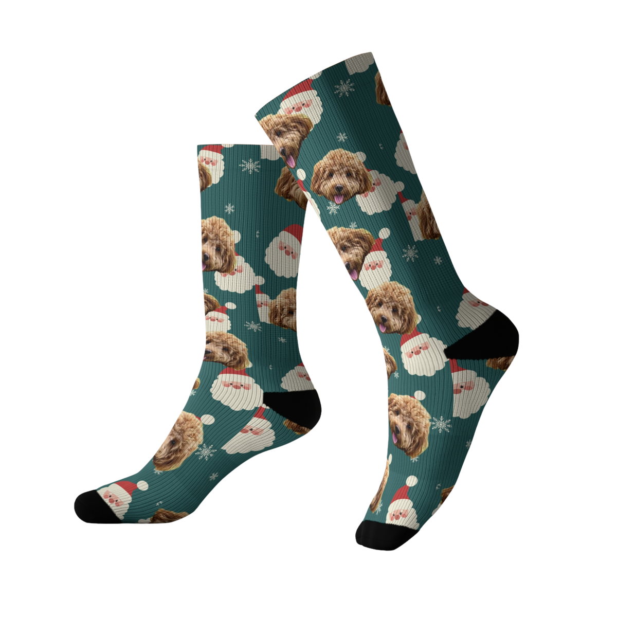 Teal green socks featuring a repeating pattern of a fluffy brown dog’s face along with Santa Claus faces, white snowflakes, and festive holiday elements. The socks have black toes and heels.