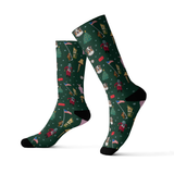 A pair of dark green crew socks featuring custom dog portraits and A Christmas Story-inspired holiday graphics, including a Christmas tree, leg lamp, house, flag, and festive characters, on a white background.