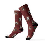 Maroon socks with dog pattern on a white background