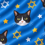 Close-up of the Star of David print showing custom pet faces with gold and white Stars of David on a blue fabric