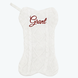 White cable knit dog-bone stocking with red 'Grant' name & hanging loop.